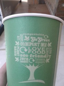 London Zoo compost coffee cup. Word cloud reads 'Go Green', 'compostable', 'low carbon', 'plant based', 'Eco Friendly'