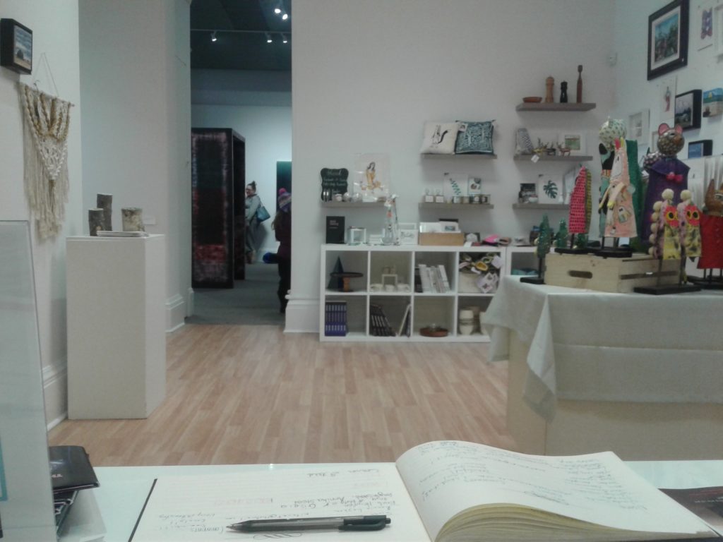 View from the desk into the shop and through the door to the AGN main gallery. 